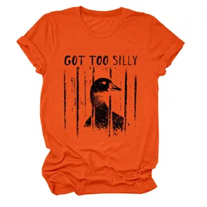 Details of the orange short sleeve t-shirt featuring a funny caged duck graphic and text.