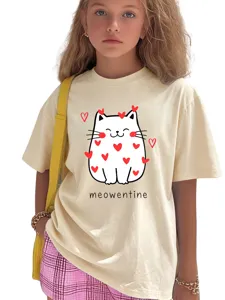 Close-up detail of the cute cat print and letter design on the kids beige t-shirt.