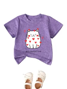 Cute cat print short sleeve t-shirt detail with matching white baby shoes for little kids.