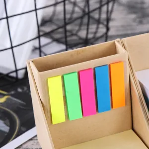 Close-up detail of desktop cardboard sticky note holder with colorful PET index tabs.
