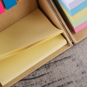 Kraft paper sticky note holder with memo pads and colorful page markers for office and desk.
