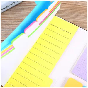 Close-up of colorful sticky notes index tabs memo pad planner stationery detail shot