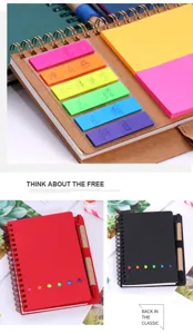 Carnet spiralé en papier kraft avec notes adhésives colorées, onglets et stylo pour bureau.