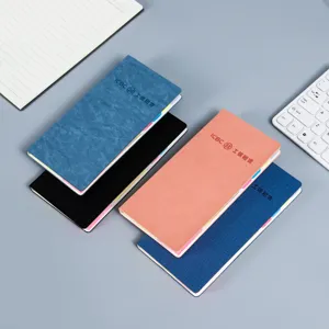 Classic hardcover business notebook with colorful index tabs, professional desk diary planner.