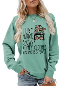 Close-up detail of the funny graphic print and soft mint green fabric on casual sweatshirt.