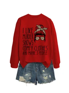 Women red long sleeve graphic sweatshirt with funny print paired with casual denim shorts.