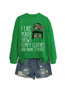 Green casual long sleeve sweatshirt with funny graphic text and denim shorts outfit.