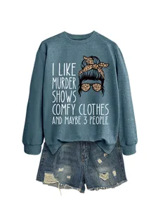Casual women's crewneck sweatshirt with funny graphic print and distressed denim shorts outfit set.