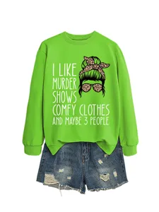 Casual green crewneck sweatshirt with fun graphic and distressed denim shorts set for women.