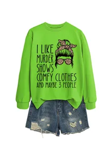 Casual green sweatshirt featuring fun true crime quote and graphic paired with denim shorts.