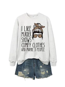 Close-up detail of the graphic sweatshirt with funny quote print and soft grey fabric texture.