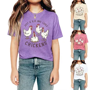 Detail view of children graphic t-shirt with cute chicken print and fun text quote.