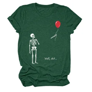Close-up detail of dark green short sleeve graphic tee featuring funny skeleton and red balloon.