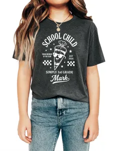 Kids short sleeve t-shirt detail showing school child graphic and custom name text.