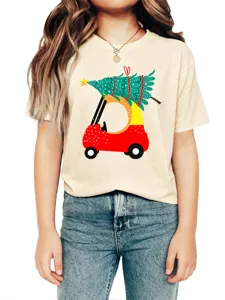 Close-up detail of the beige graphic tee featuring a festive car and Christmas tree design.