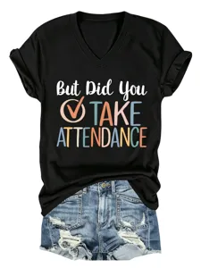 Detail shot of casual black V-neck t-shirt featuring fun slogan print and comfortable short sleeves.