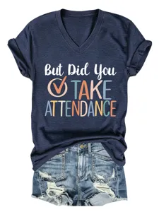 Detailed shot of a casual dark blue v-neck t-shirt with text print paired with denim shorts.