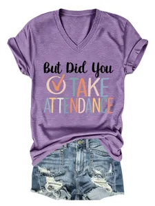 Detailed view of the purple V-neck short sleeve tee with funny quote print and denim shorts.