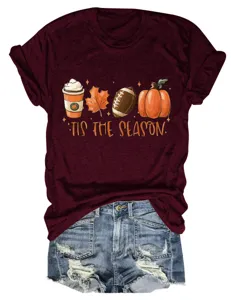 Vista dettagliata di t-shirt a manica corta con grafica di zucca autunnale e stampa.