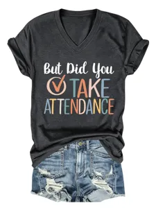 Casual women's dark gray V-neck short sleeve graphic t-shirt paired with ripped denim shorts.