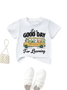 Cute graphic print detail on kids white t-shirt featuring school bus and animal cartoon design.