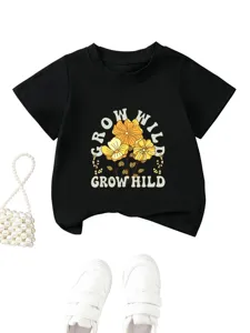 Kids black short sleeve t-shirt detail showing floral print and soft fabric texture.