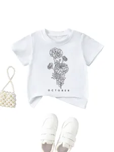 Detail view of white children t-shirt featuring elegant floral line art and october text.