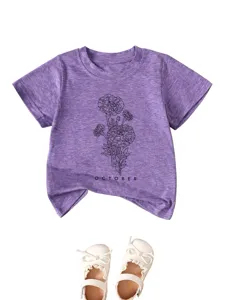 Detailed view of purple toddler short-sleeve t-shirt with line-art floral and october text.