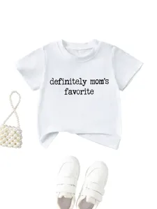 Details of white baby t-shirt with slogan print, styled with pearl bag and casual sneakers.