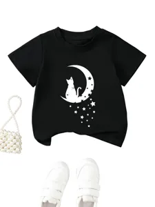 Kids black short sleeve t-shirt featuring cat on moon and stars graphic, casual top.