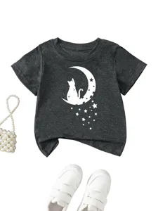 Detail shot of kids short sleeve t-shirt featuring cat moon graphic on dark gray fabric.