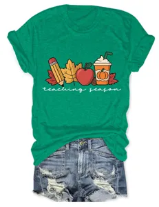 Women green short sleeve t-shirt with teaching season autumn graphic print details.