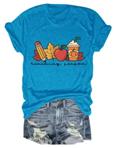 Vibrant blue short sleeve t-shirt detail showing the cute teaching season graphic print.