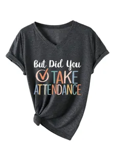 Dark grey V-neck t-shirt detail showing chest slogan print and front knotted hem design.