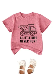 Detail view of kids pink short sleeve t-shirt featuring cute dump truck graphic print.