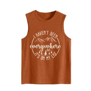 Detail of the rust orange women tank top featuring travel quote and mountain print.