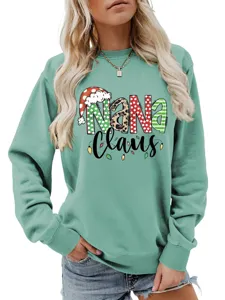 Close-up view of the Christmas themed Nana Claus print detail on mint green sweatshirt.
