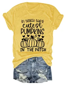 Women cute pumpkin print short sleeve round neck casual t-shirt paired with denim shorts.
