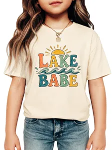 Kids graphic tee detail shot featuring a retro sun and waves lake babe print design close up.