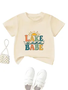 Detailed view of the cute kids short-sleeve tee featuring lake babe print and summer vibes.