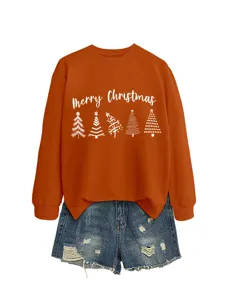 Women's orange Christmas tree graphic sweatshirt paired with stylish distressed denim shorts.