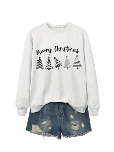 Close-up detail of casual grey Christmas tree print sweatshirt with denim shorts.