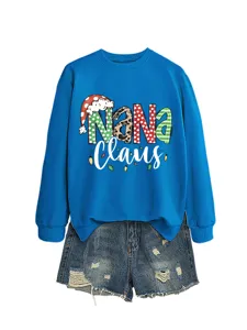 Women's blue Christmas Nana Claus graphic crewneck sweatshirt paired with stylish denim shorts.