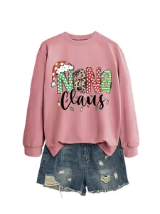 Women's pink Christmas Nana Claus graphic crewneck sweatshirt with distressed denim shorts.