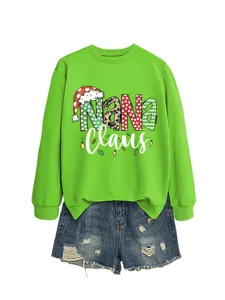 Women's Christmas Nana Claus graphic green sweatshirt paired with stylish denim shorts casual.