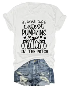 Detailed view of white short sleeve t-shirt featuring cute pumpkin graphic and letter print.