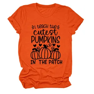 Detail shot of bright orange short sleeve round neck t-shirt with teacher pumpkin design.