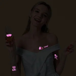 Adesivi per tatuaggi temporanei luminosi d'amore per feste, design d'arte corporea al neon.
