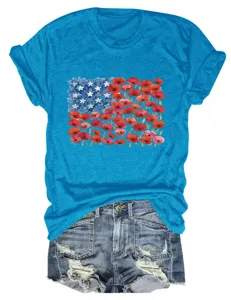 Women's casual blue short sleeve crewneck t-shirt with red and blue floral flag graphic detail.