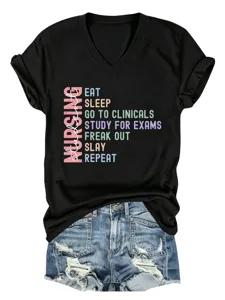 Detail view of the black V-neck nursing student t-shirt with colorful typography design.